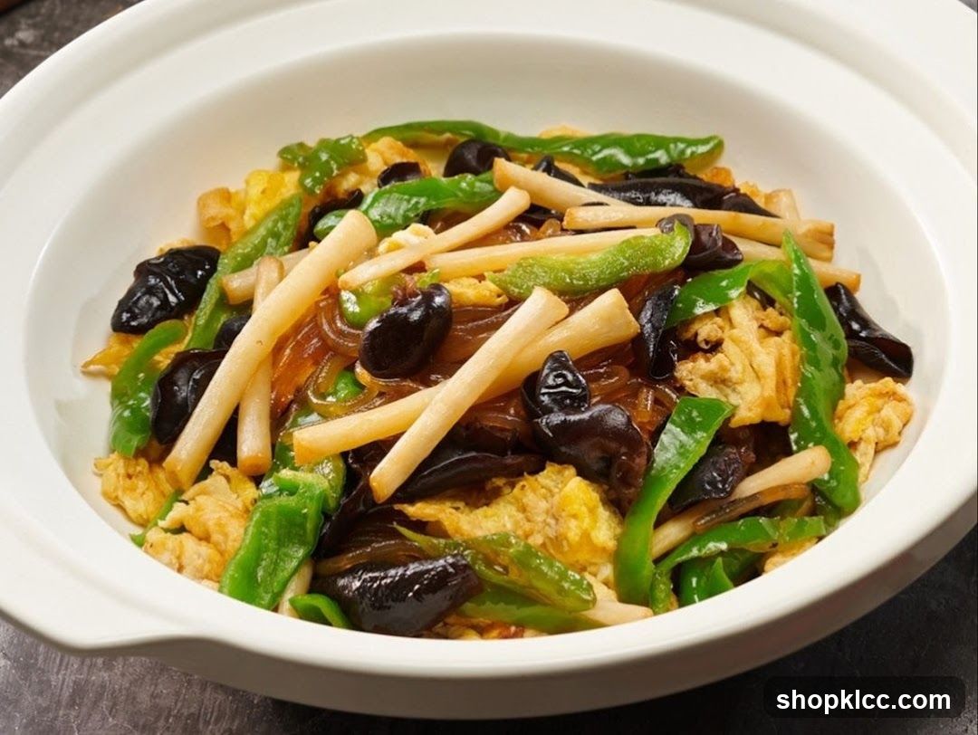 Stir-fried dish with noodles, vegetables, and mushrooms