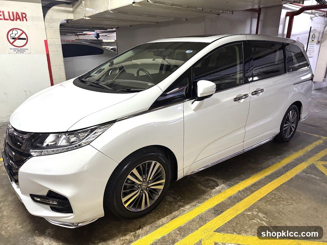 White Minivan in Parking Garage