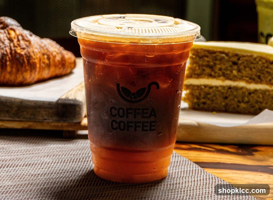 Iced Coffee with Croissant and Cake