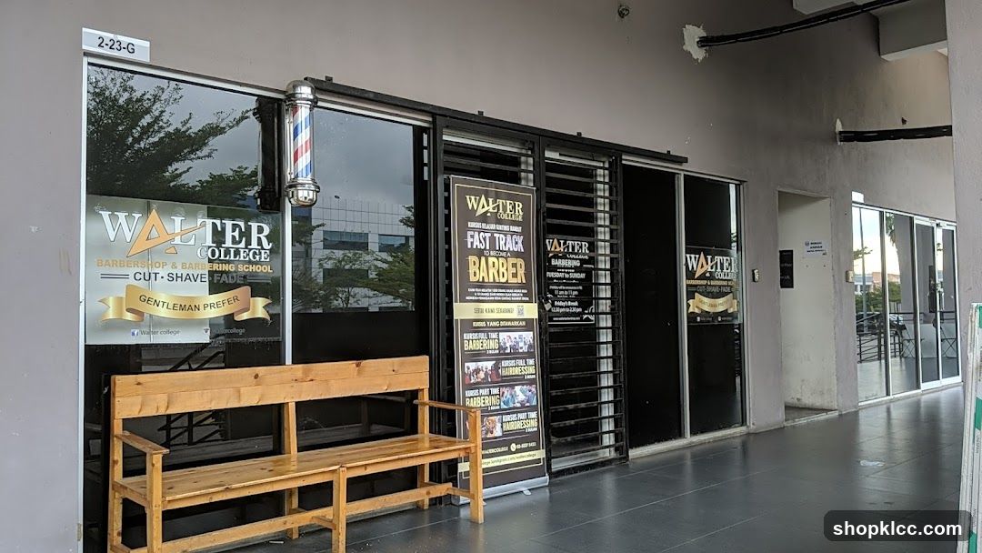 The exterior of a barbershop and barbering school with large glass windows. A wooden bench is placed in front of the entrance. A barber pole is visible outside one of the windows. Signage on the window reads "WALTER COLLEGE BARBERSHOP & BARBERING SCHOOL CUT SHAVE FADE GENTLEMAN PREFER". A banner on a stand outside the entrance advertises "WALTER COLLEGE FAST TRACK TO BECOME A BARBER" and lists various barbering courses.