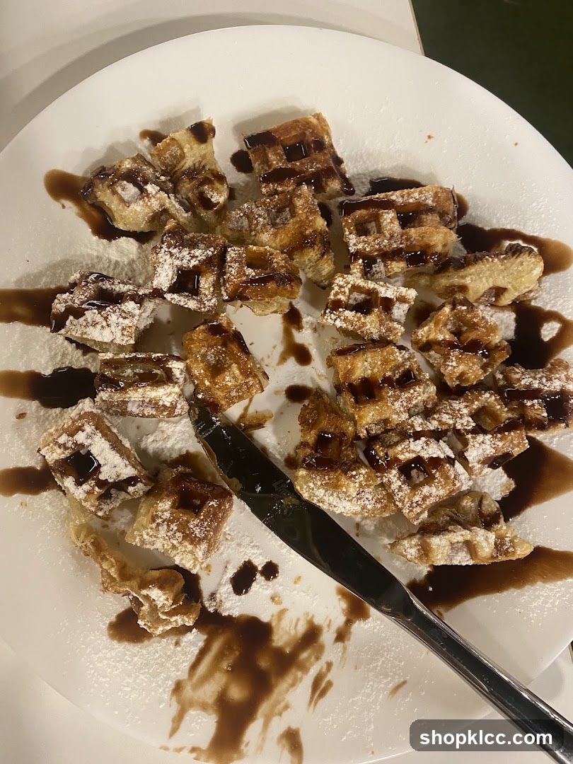 Waffles with Chocolate Sauce and Powdered Sugar