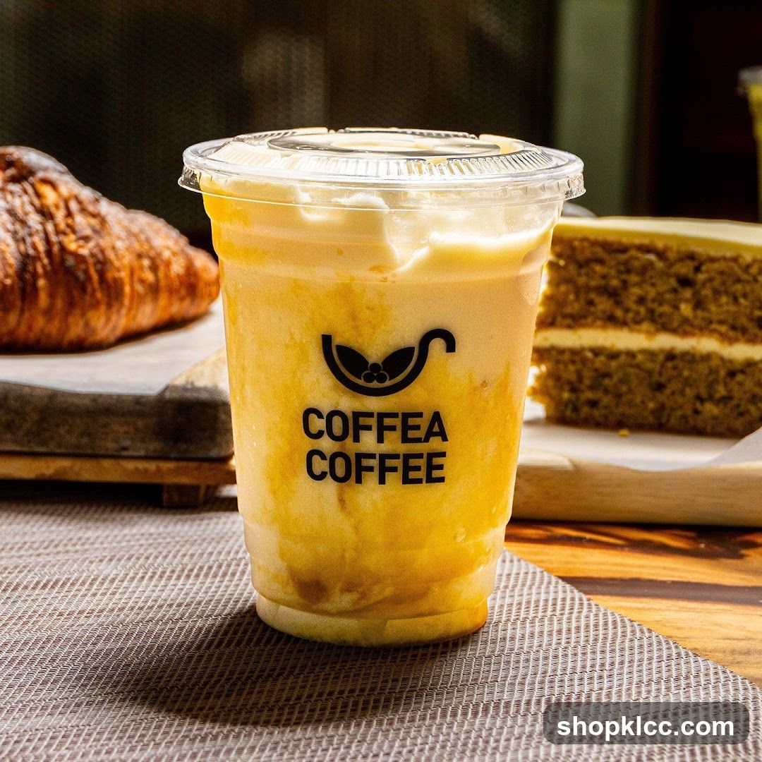 Iced Coffee Drink with Croissant and Cake