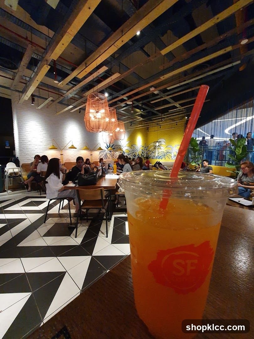Interior of a cafe with a drink in the foreground