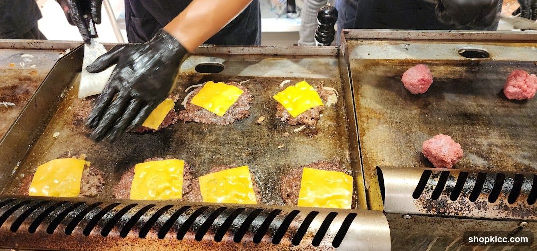 Burger Patties Cooking on a Griddle