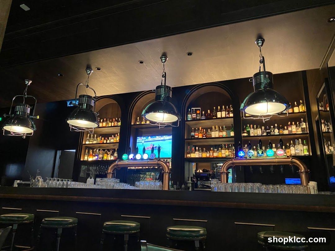 Bar Interior with Shelves of Bottles and Beer Taps