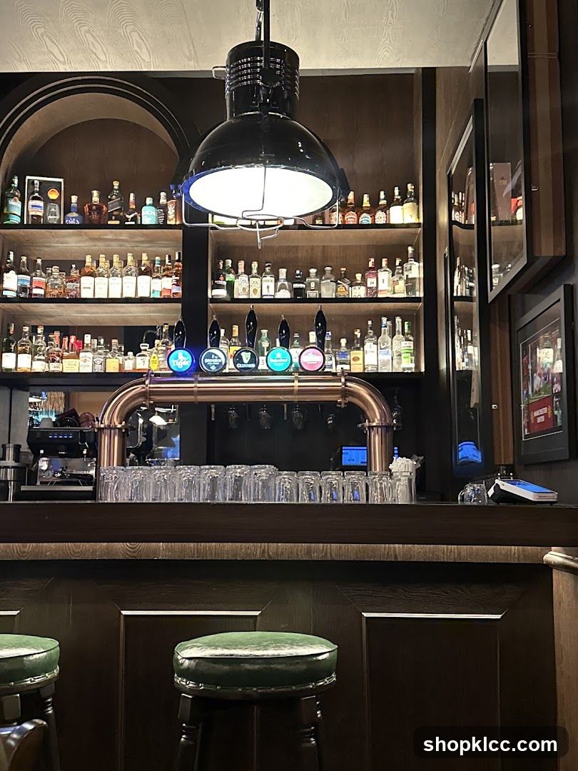 Bar Interior with Beer Taps and Shelves of Bottles