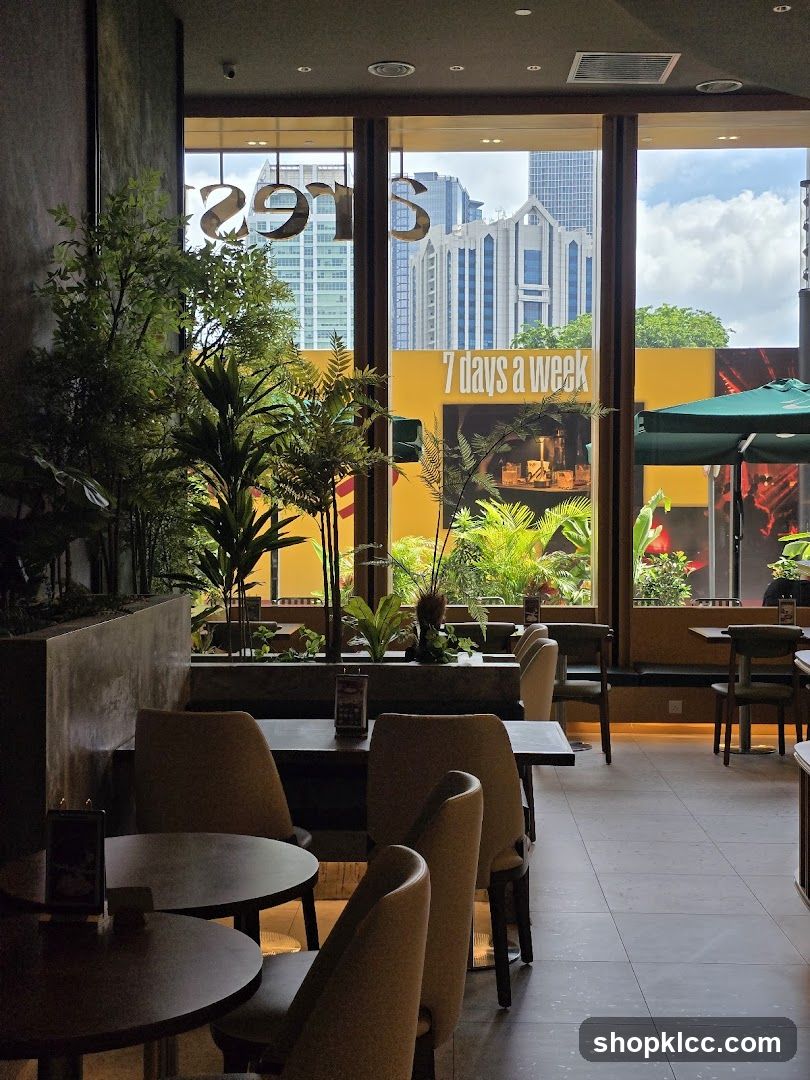 Interior of a cafe with plants and city view