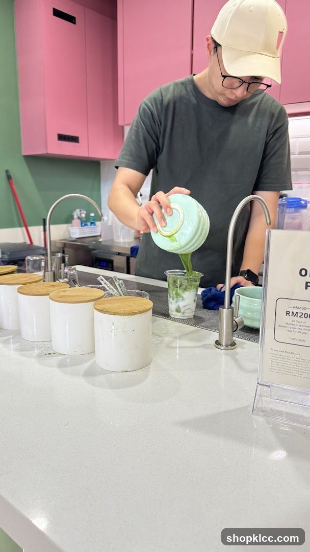 Barista preparing a matcha drink