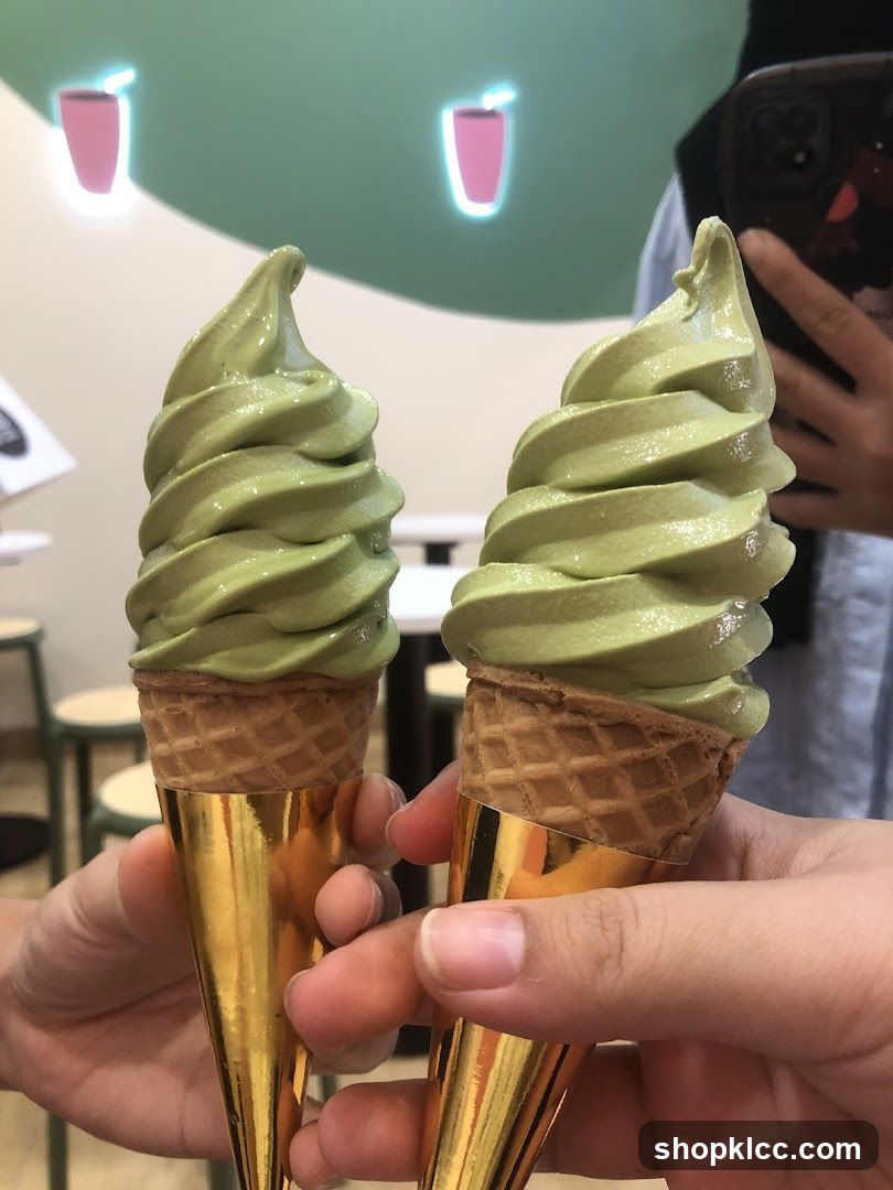 Two Green Soft Serve Ice Cream Cones