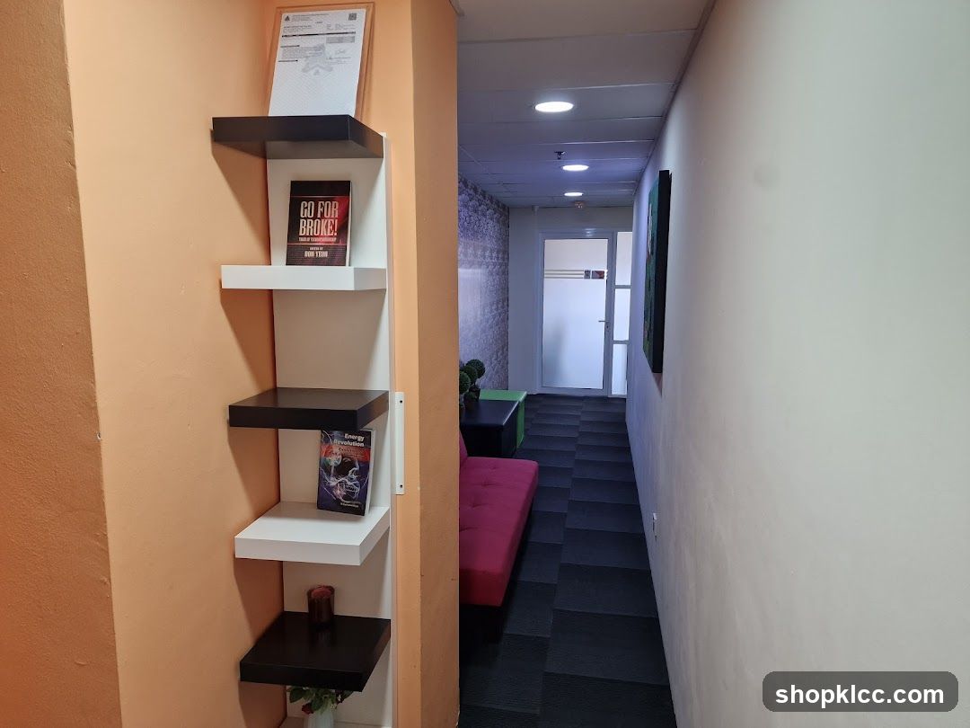 Office Hallway with Bookshelf and Seating Area