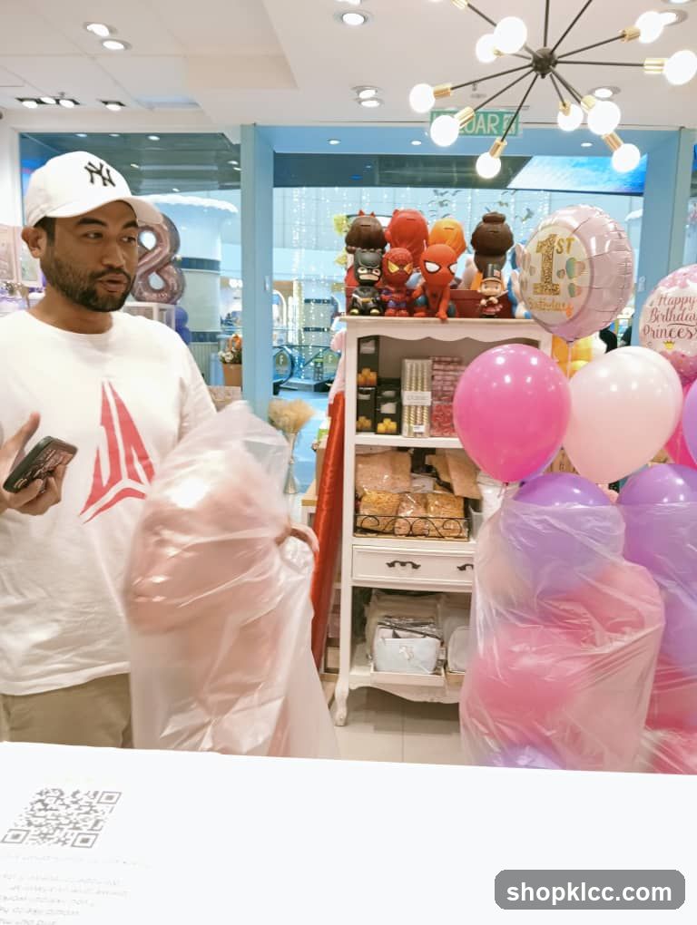 Man holding balloons in a party supply store