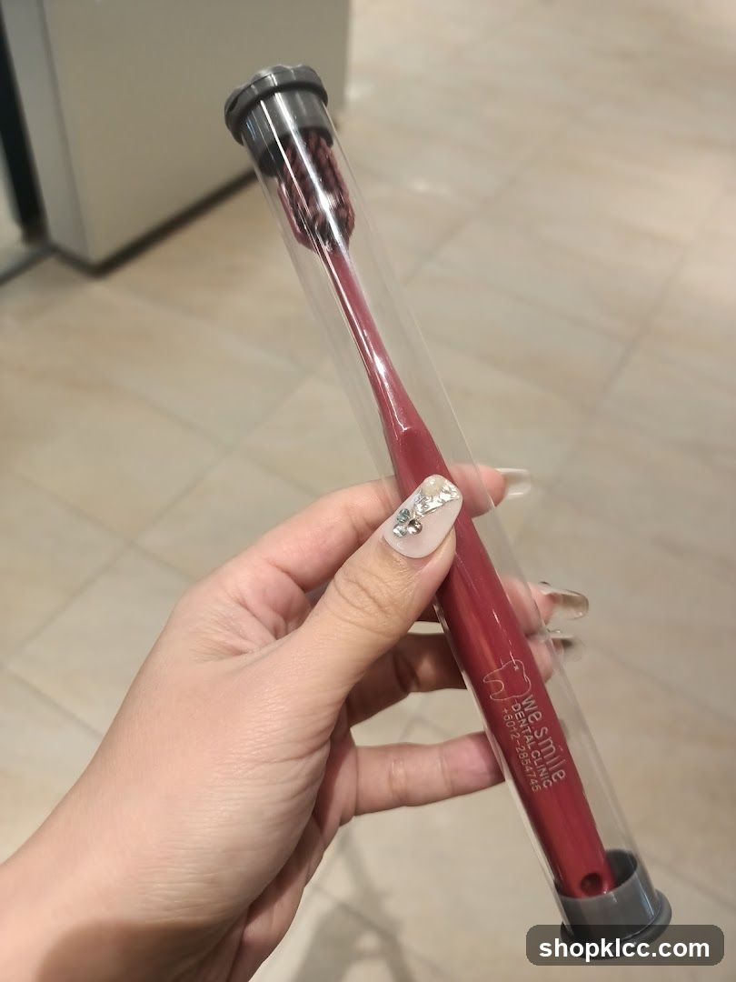 Red toothbrush in protective case