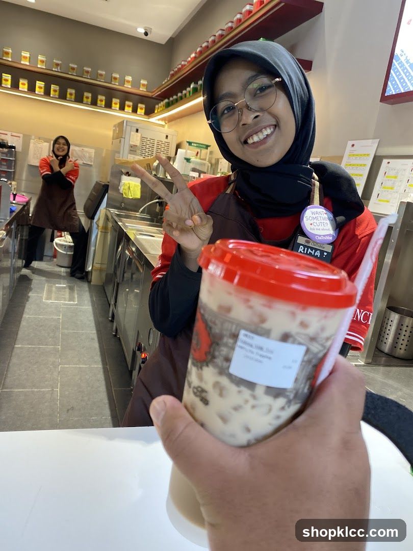 Staff holding a drink