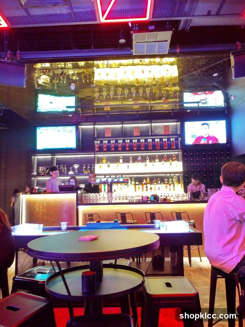 Bar Interior with Televisions and Bottles