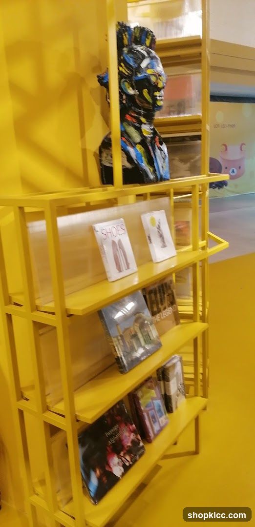 Yellow Display Shelf with Artifacts and Books