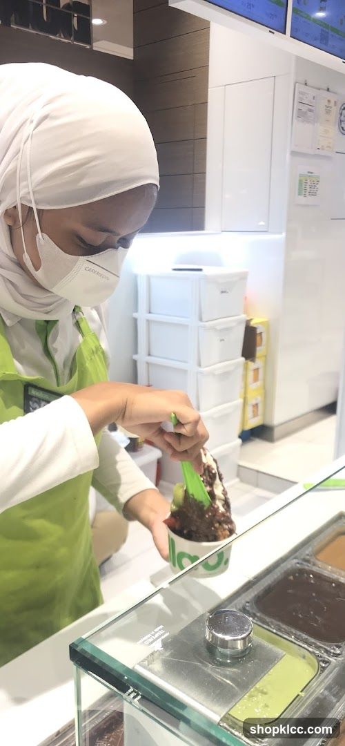 Staff preparing shaved ice dessert