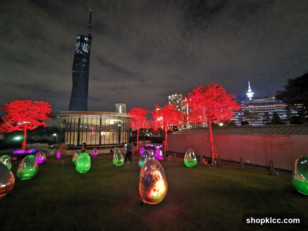 Night Cityscape with Illuminated Trees and Sculptures