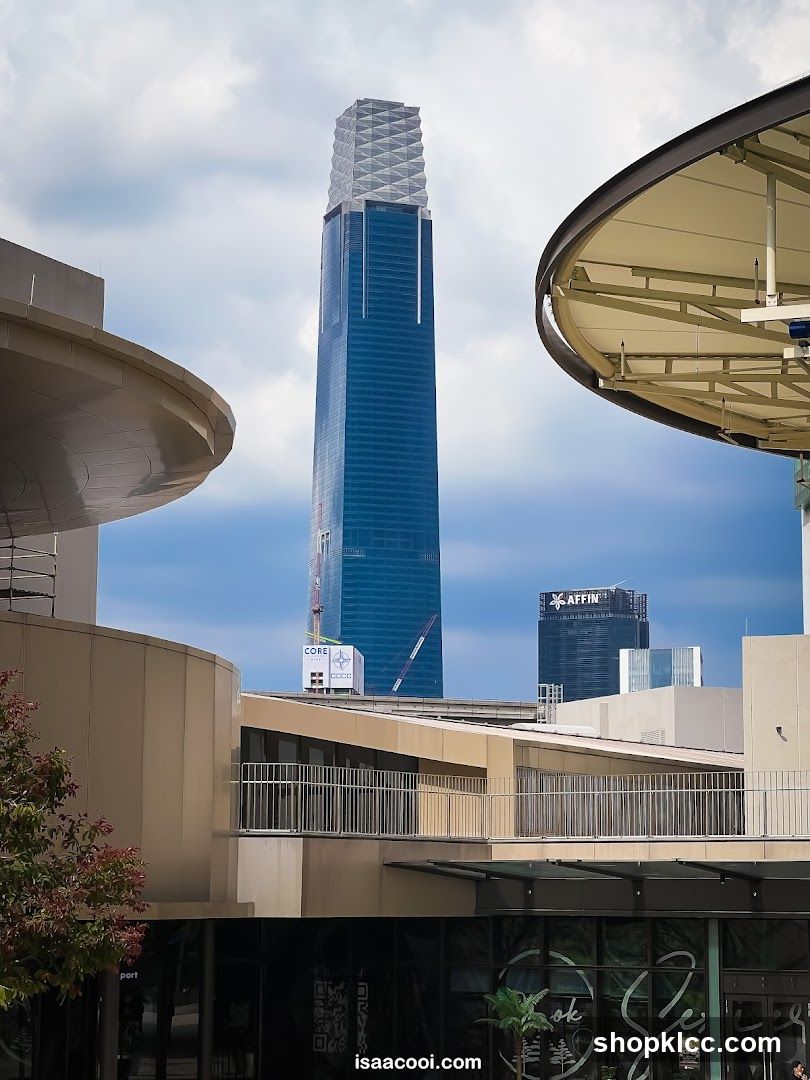 Tall Blue Skyscraper with Affin Building in Background
