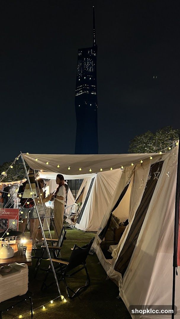 Night Camping Scene with Tower in Background