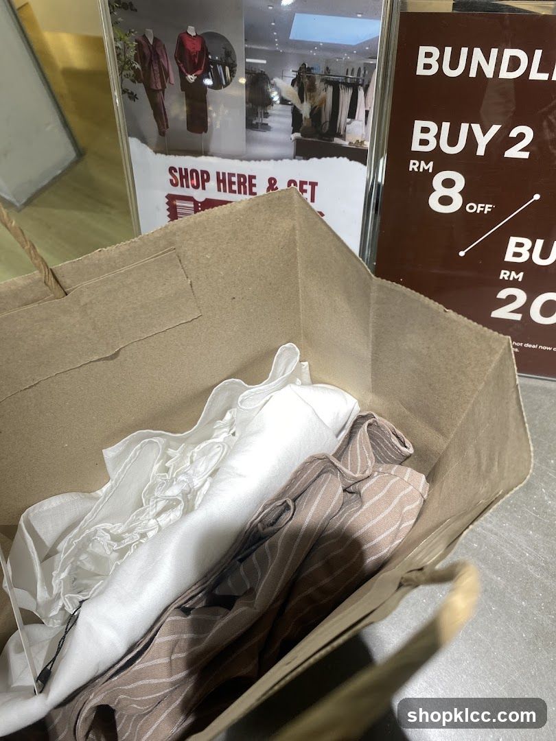 Shopping Bag with Clothing and Sale Signs