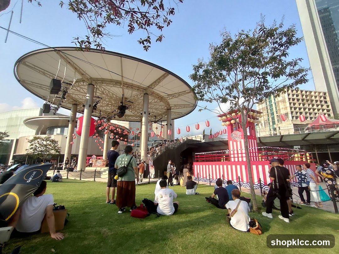 Outdoor Event with Stage and Crowd