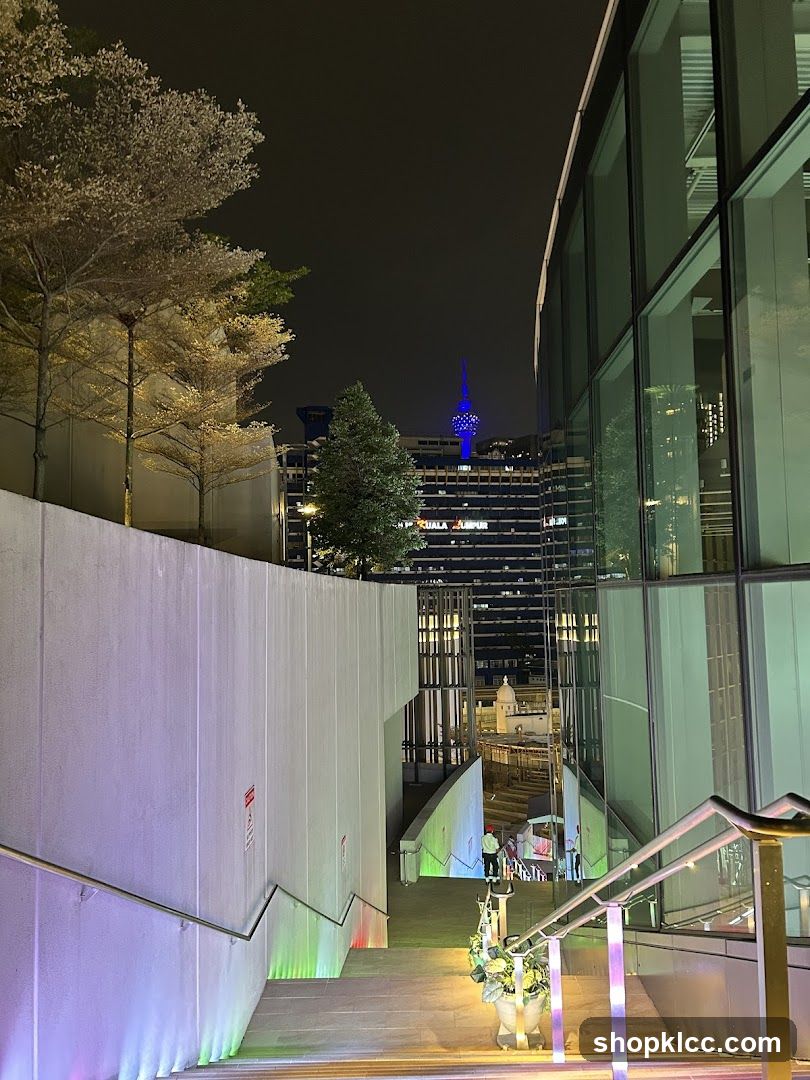 Night View of Modern Architecture with Cherry Blossoms