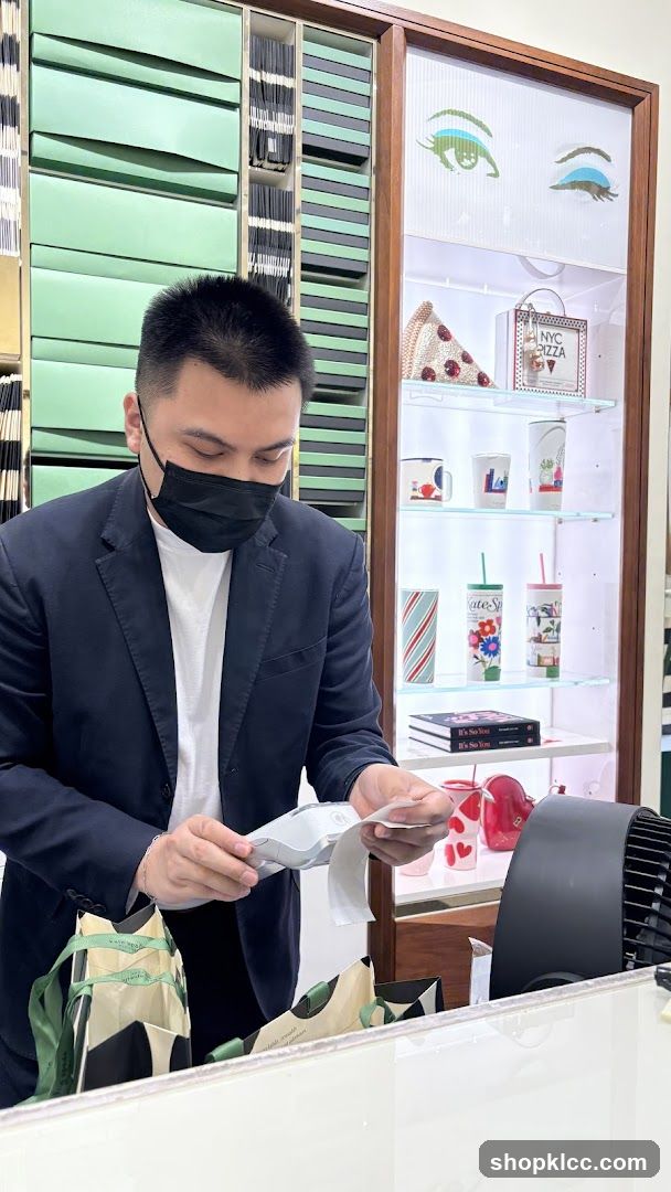Man at Counter with Merchandise