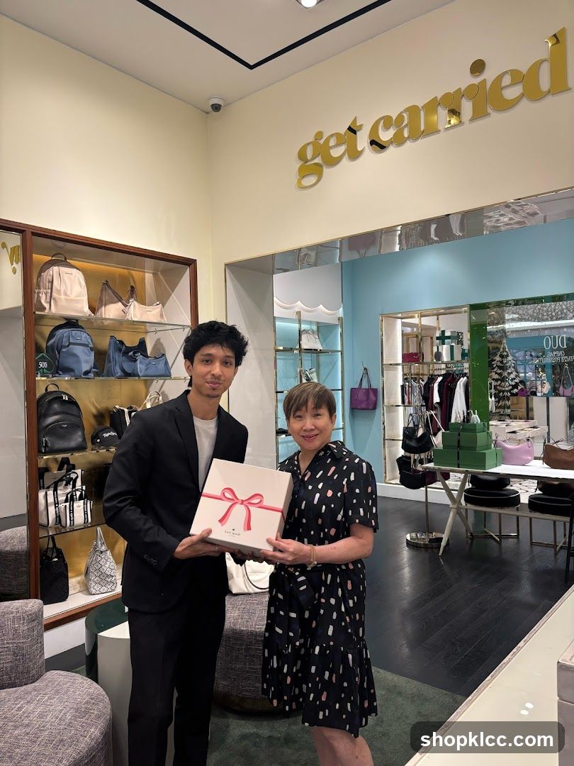 Two people holding a gift box in a store