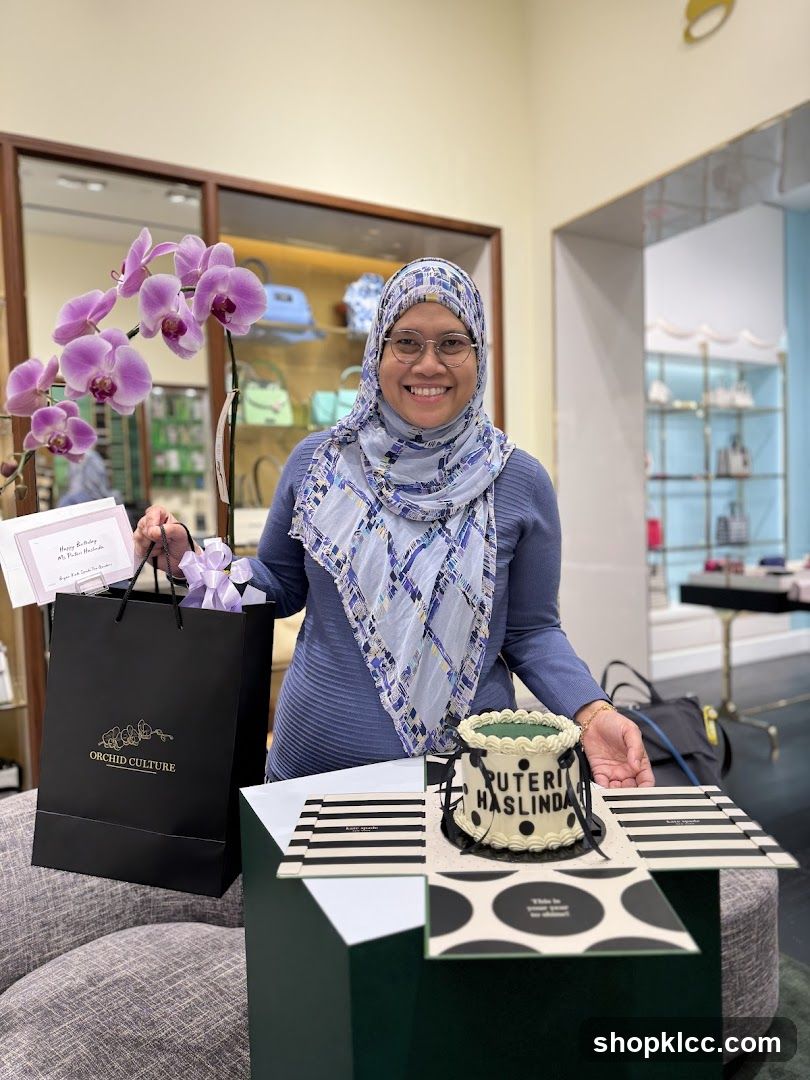 Woman with a cake and orchid plant