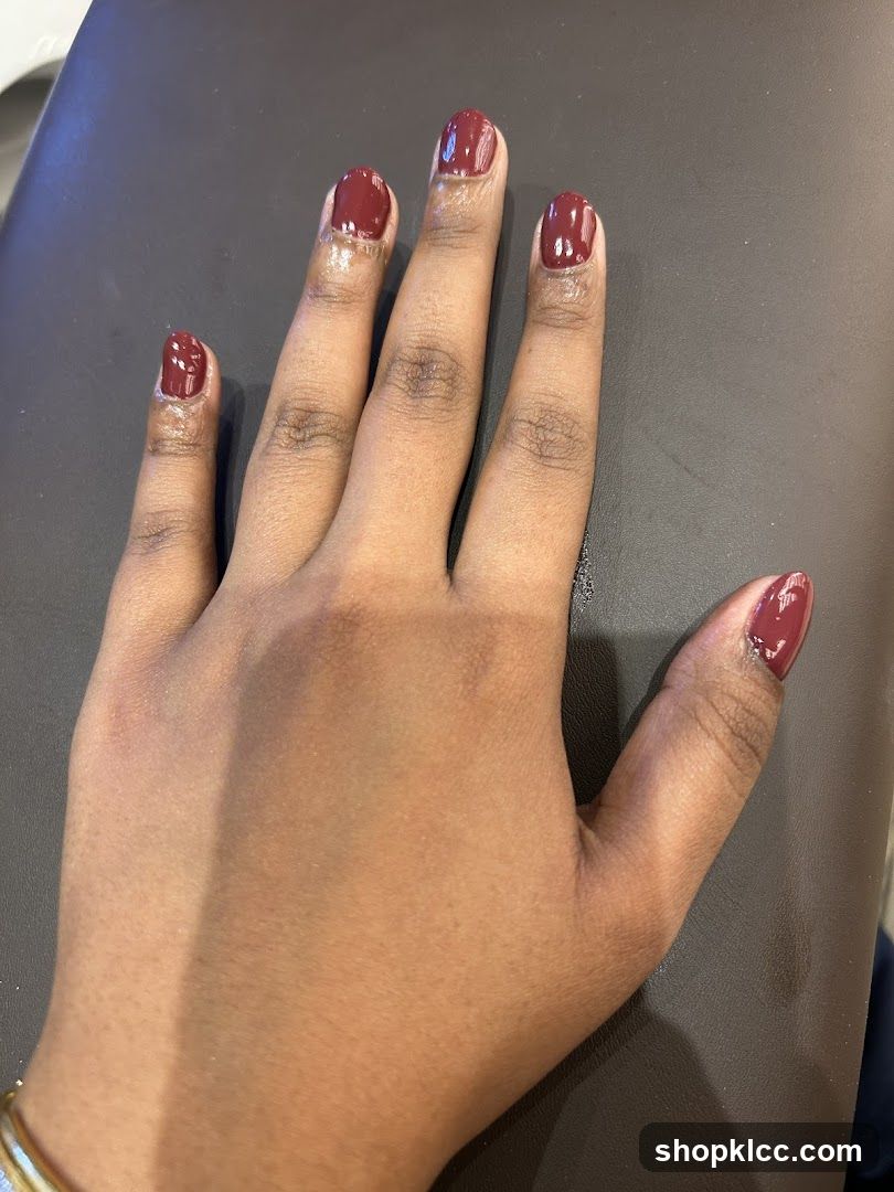 Hand with Burgundy Nails