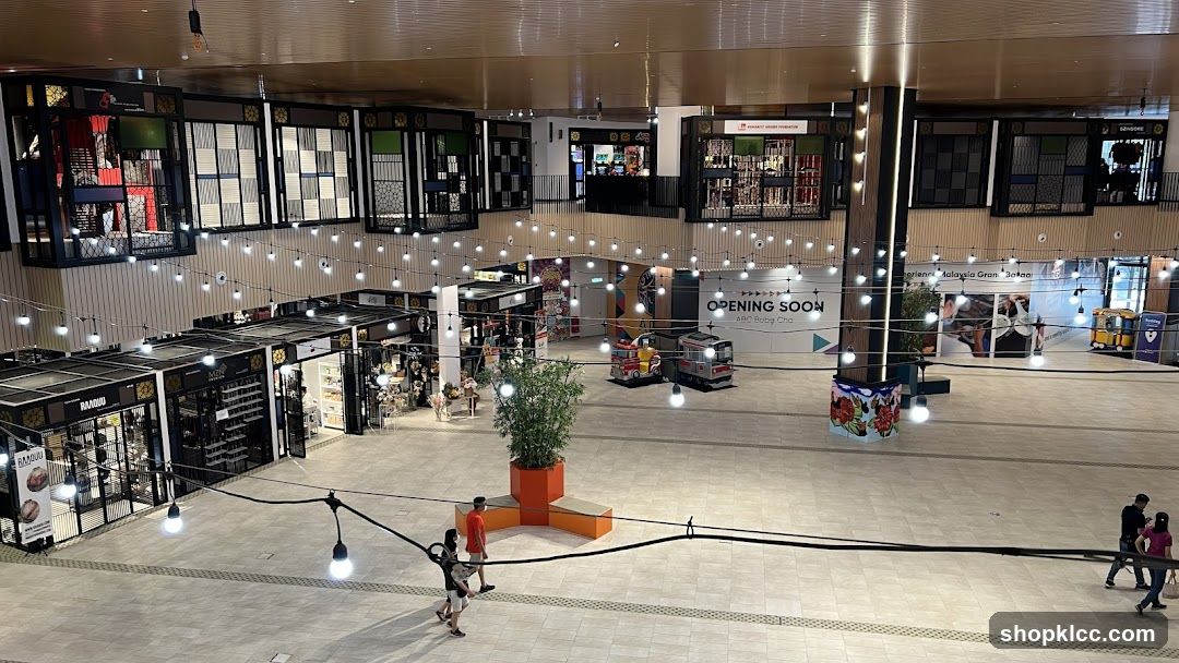 Indoor shopping mall with various shops and decorations
