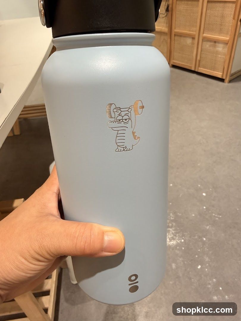 Water Bottle with Cartoon Dragon Graphic