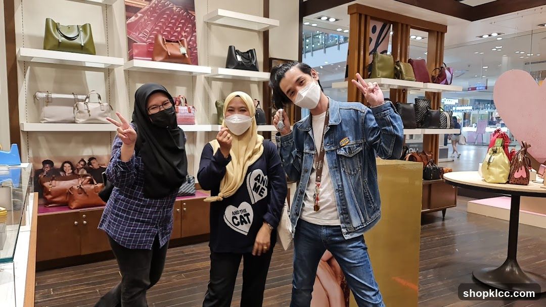 People Posing in a Handbag Store