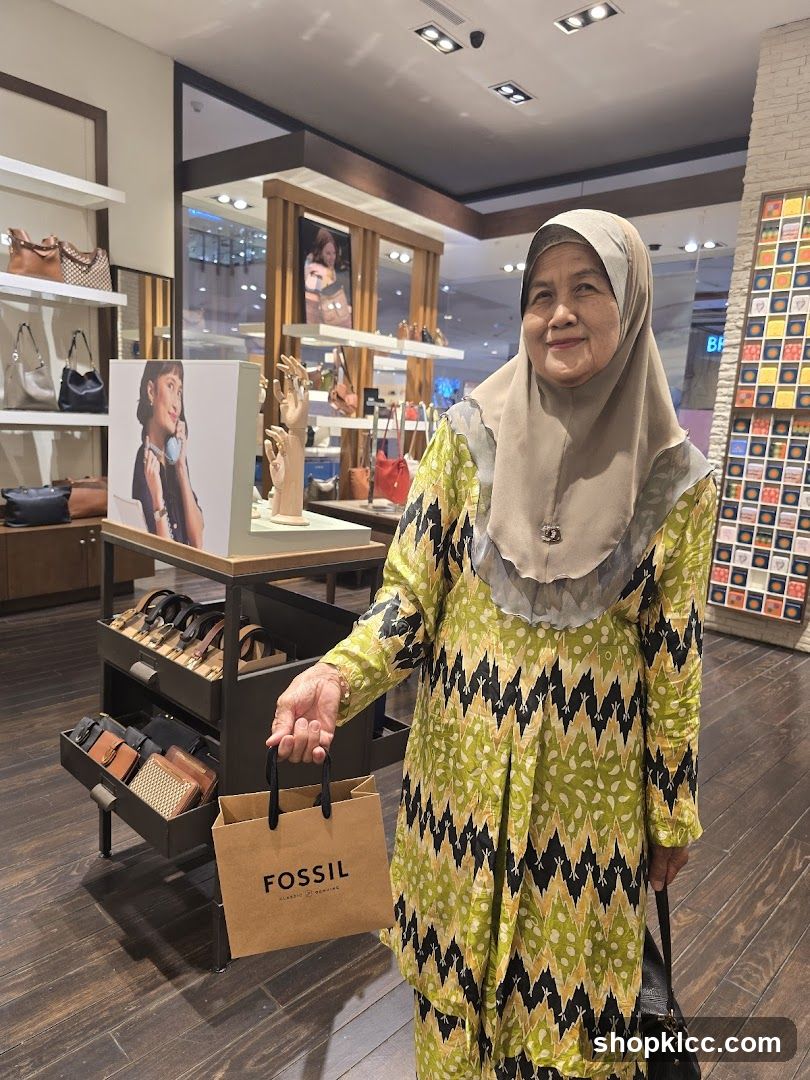 Woman holding a Fossil shopping bag in a store