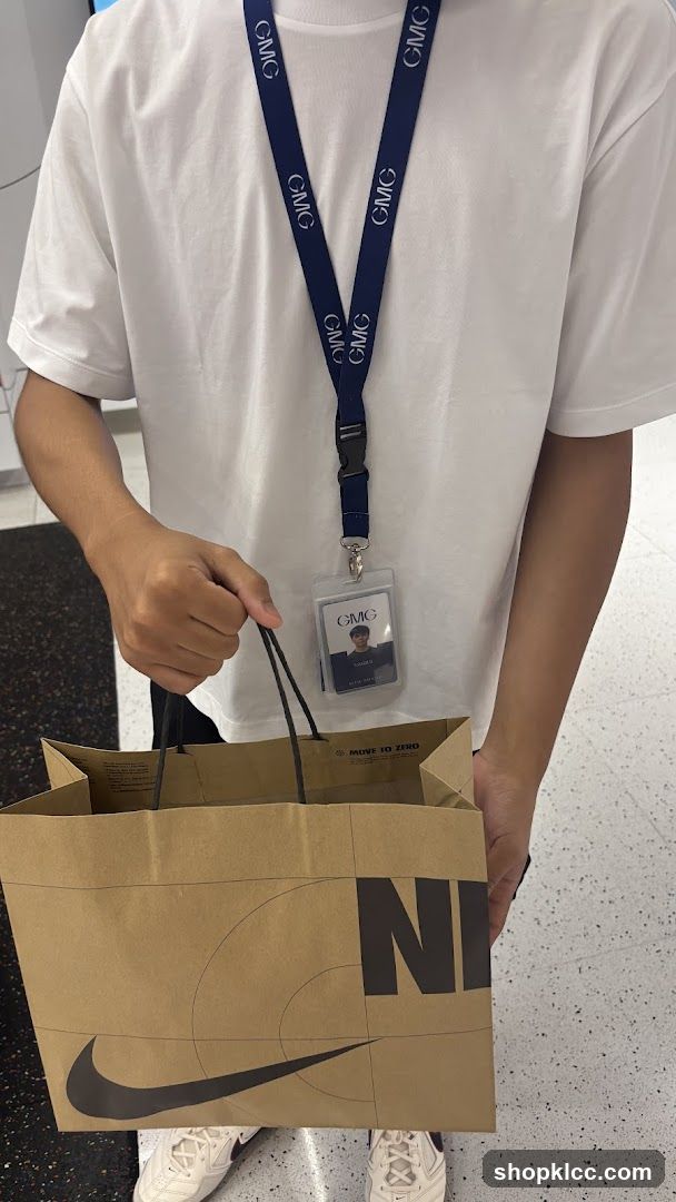 Person holding a Nike shopping bag