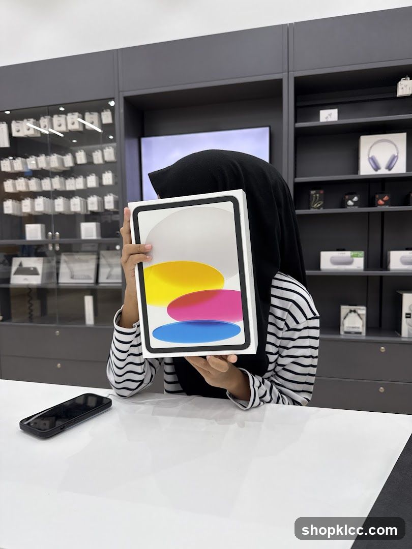 Person holding an iPad box