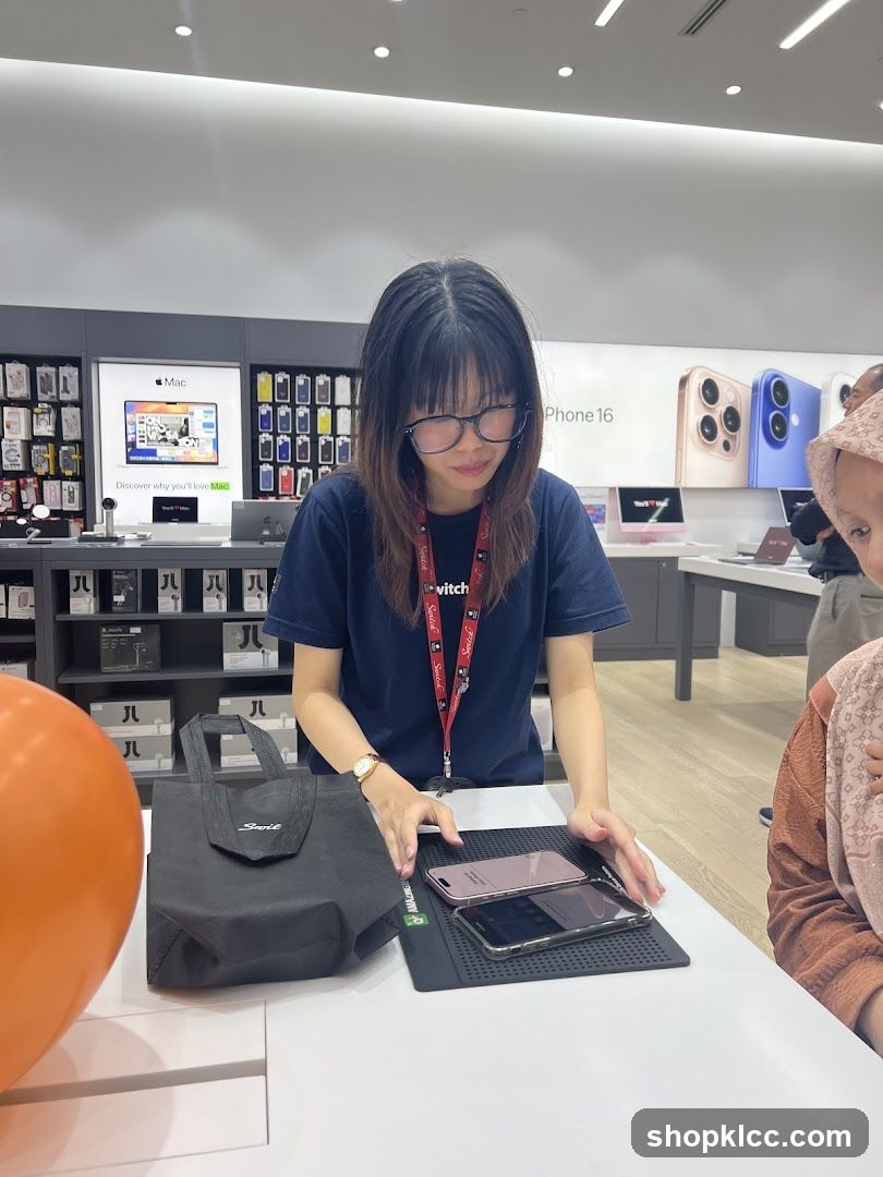 Salesperson showing phones