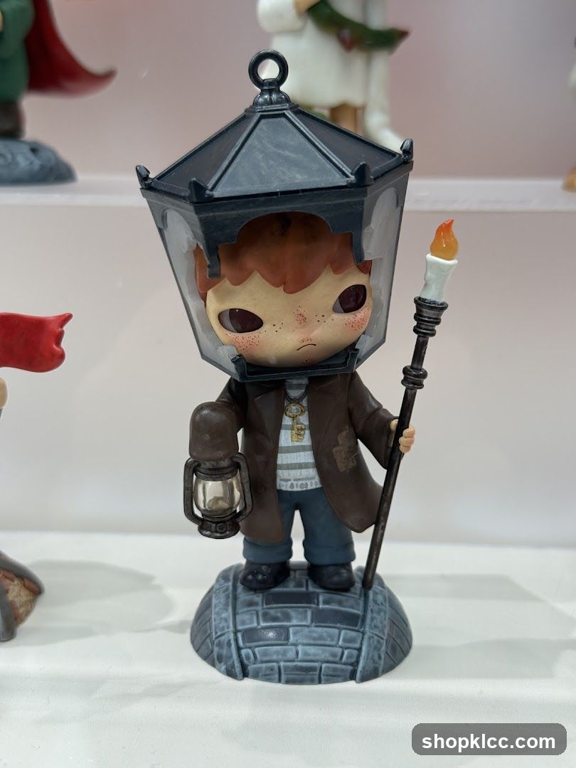 Figurine of a boy with a lantern head