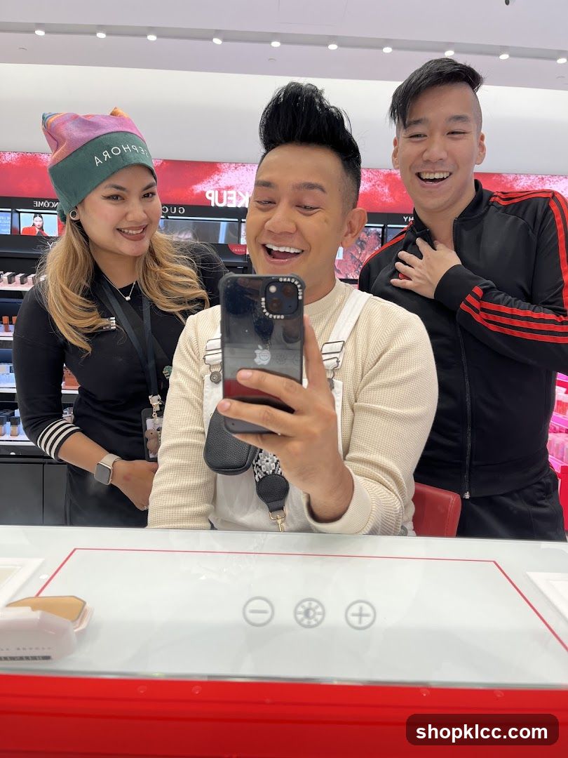 Three people posing for a selfie in a makeup store