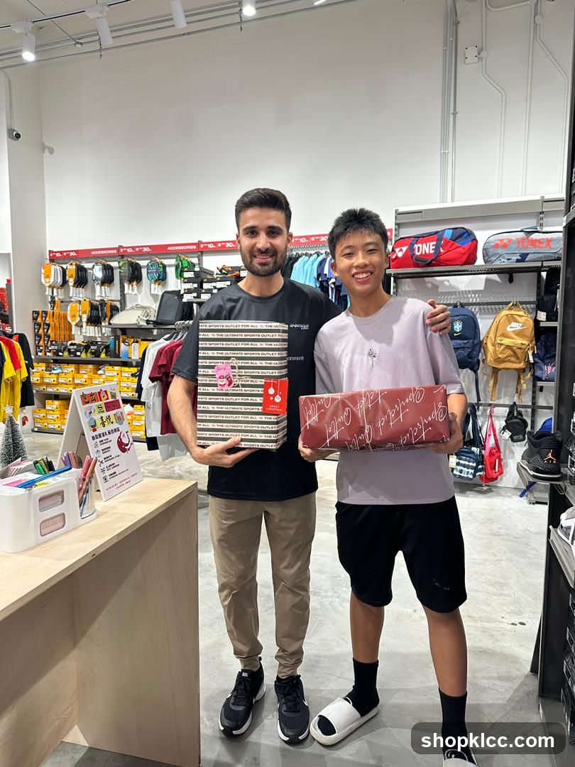 Two people holding gift boxes in a sports store