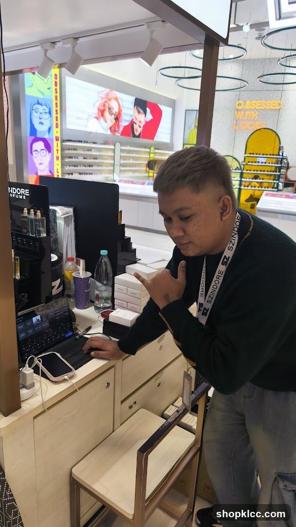 Man working at a counter in a store