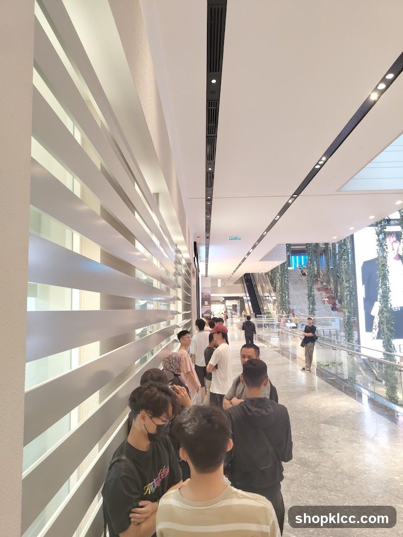 People in a Mall Corridor