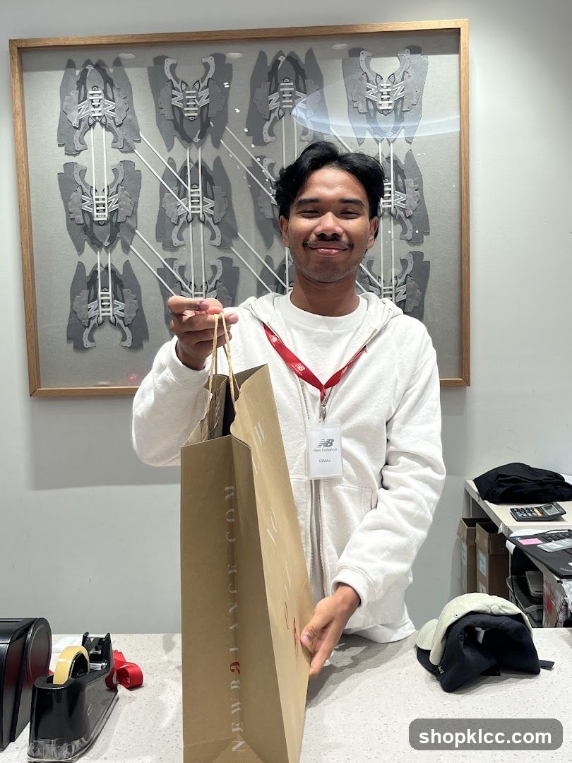 Employee holding a shopping bag