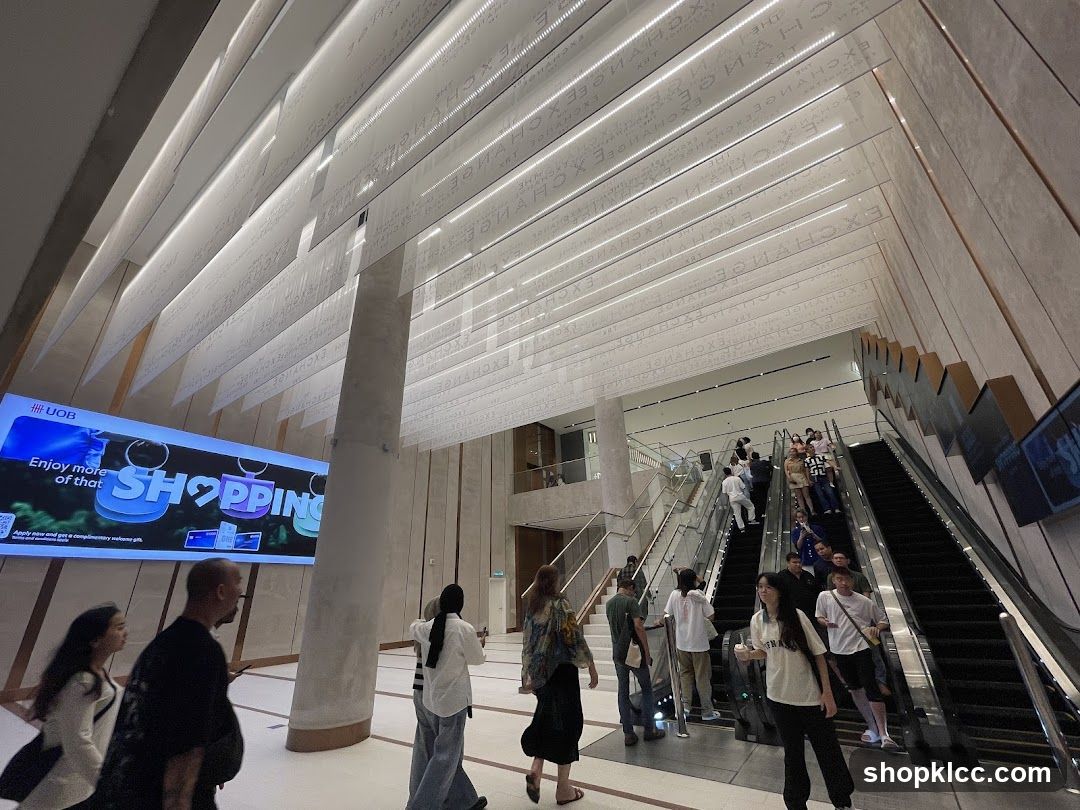 Modern Interior with Escalators and Digital Display
