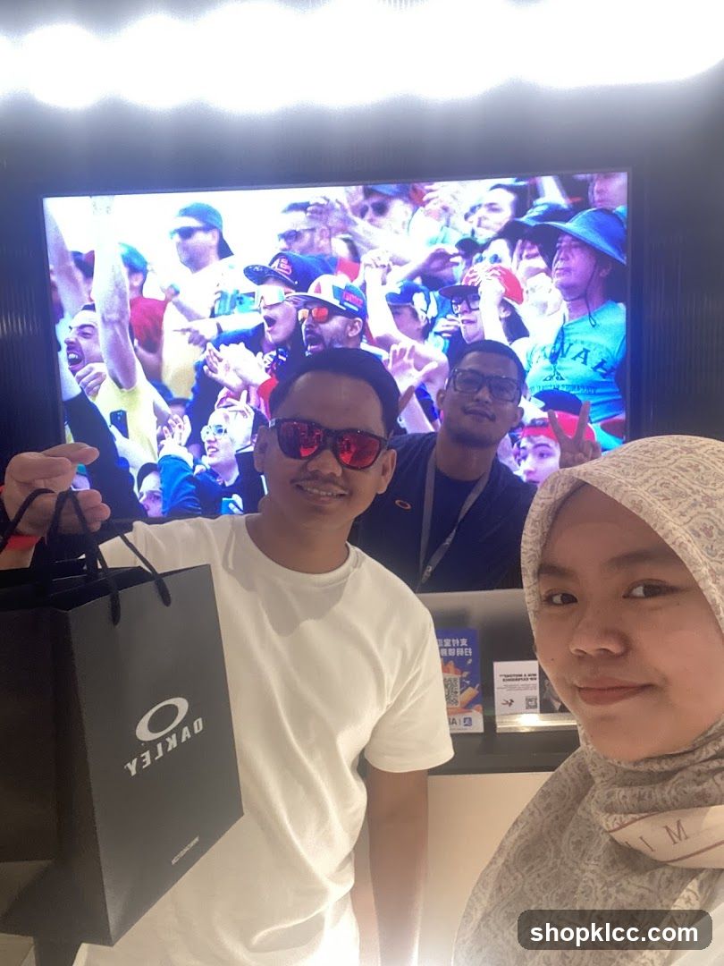 People posing with shopping bag