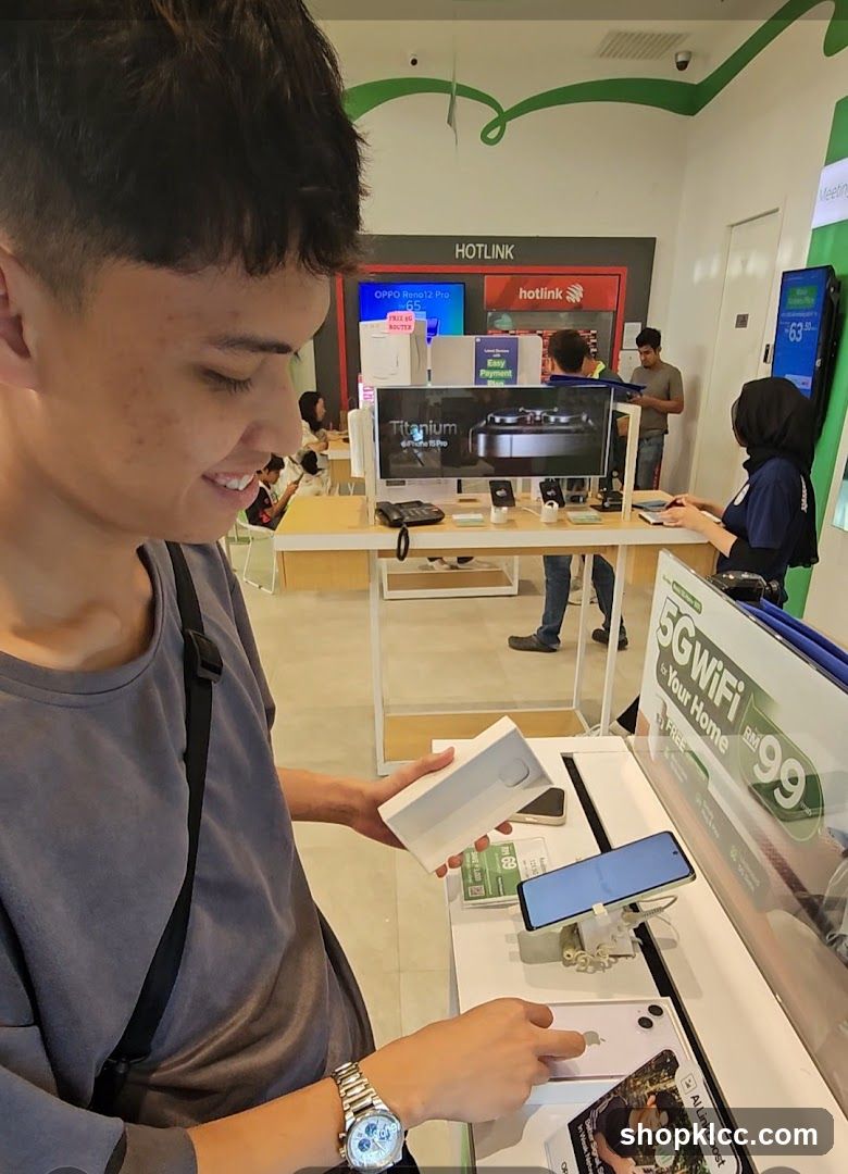 Customer examining a phone box