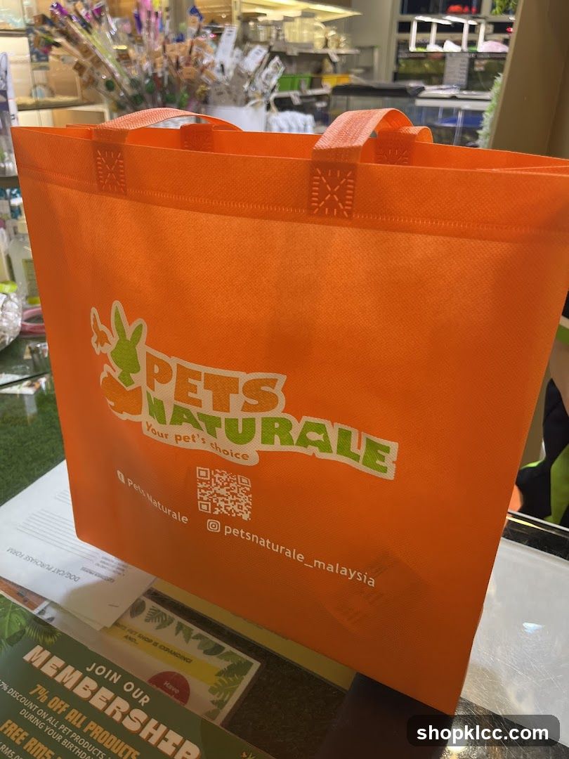 Orange tote bag with pet store logo