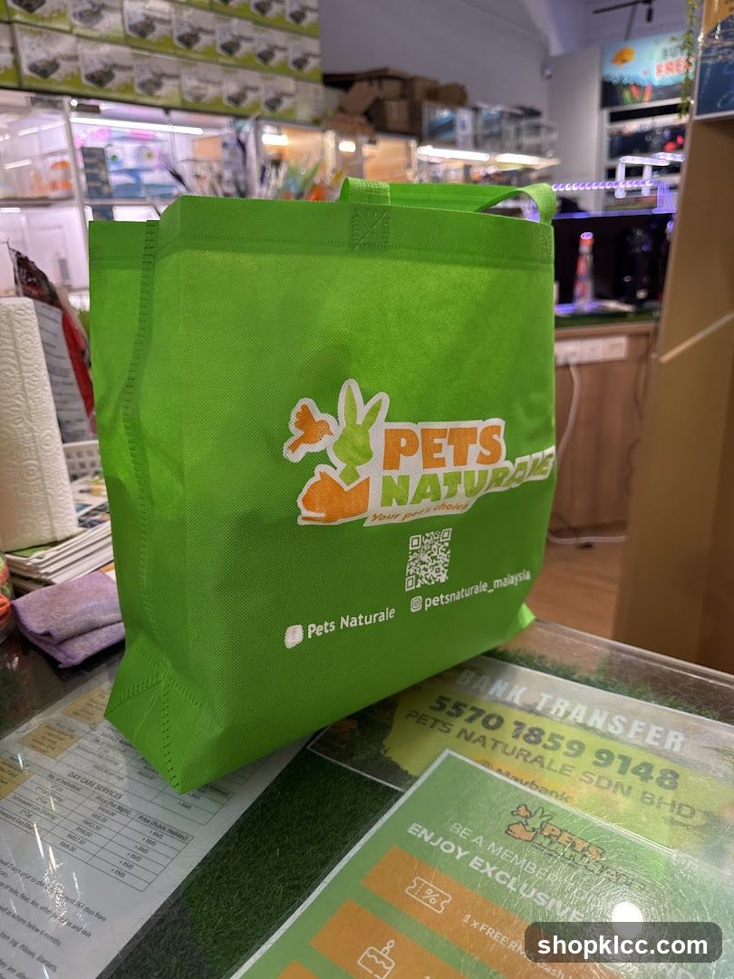 Green tote bag with pet store logo