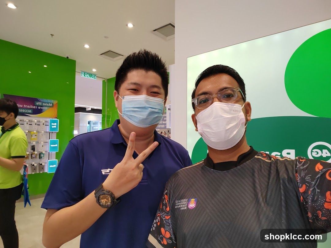 Two men in masks posing for a photo