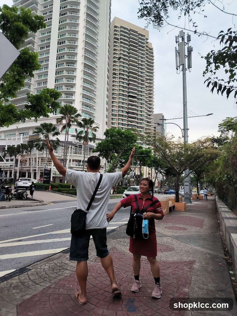 People on Sidewalk with Tall Buildings